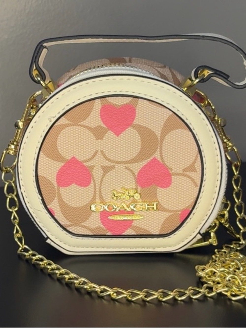Coach Tan Canvas Mini Round Crossbody with Pink Heart Accents
